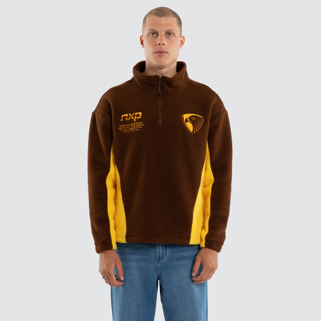 Model wears Hawthorn Hawks AFL Defence Pullover Brown & Yellow Jumpers in Brown - Image 4