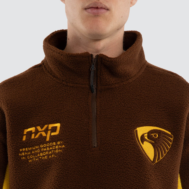 Model wears Hawthorn Hawks AFL Defence Pullover Brown & Yellow Jumpers in Brown - Image 2