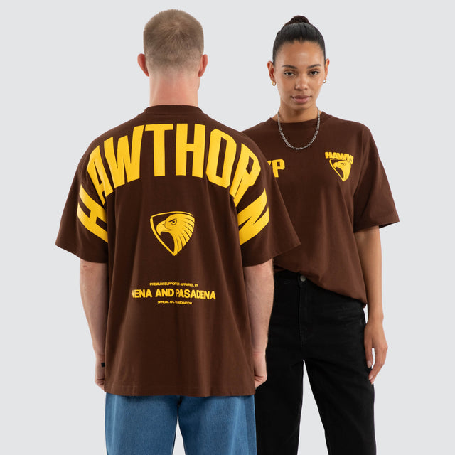Model wears Hawthorn Hawks AFL Archive Raptor Tee Brown T-Shirts in Brown - Image 1