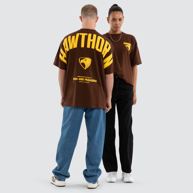 Model wears Hawthorn Hawks AFL Archive Raptor Tee Brown T-Shirts in Brown - Image 3
