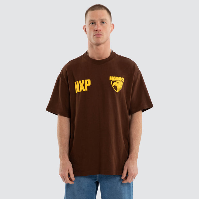 Model wears Hawthorn Hawks AFL Archive Raptor Tee Brown T-Shirts in Brown - Image 2