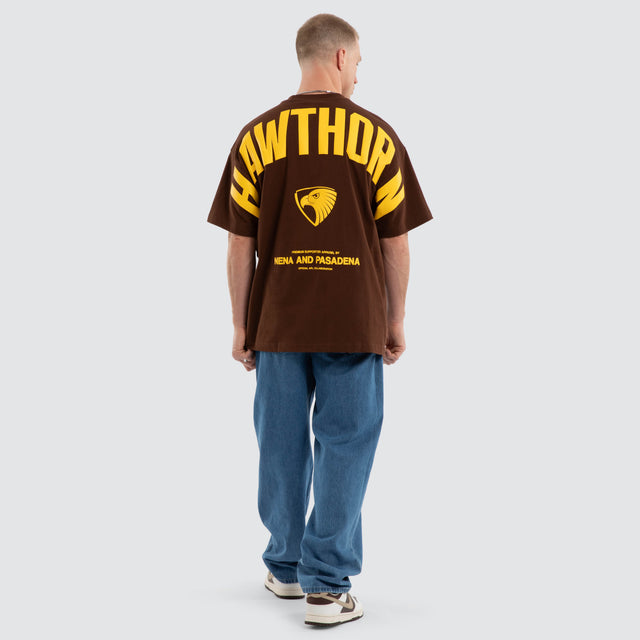 Model wears Hawthorn Hawks AFL Archive Raptor Tee Brown T-Shirts in Brown - Image 6