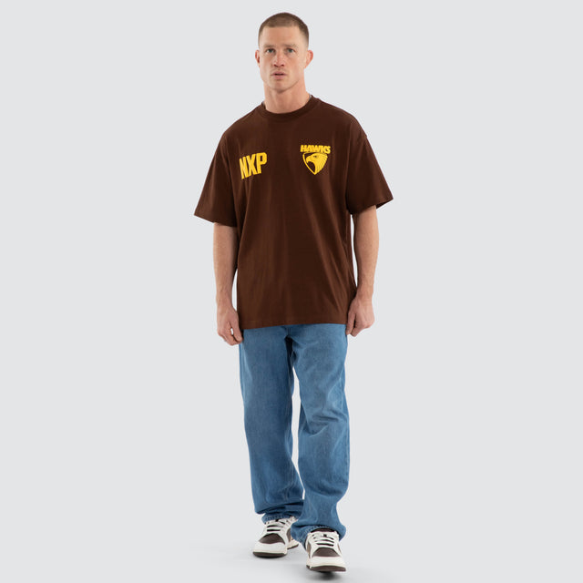 Model wears Hawthorn Hawks AFL Archive Raptor Tee Brown T-Shirts in Brown - Image 7