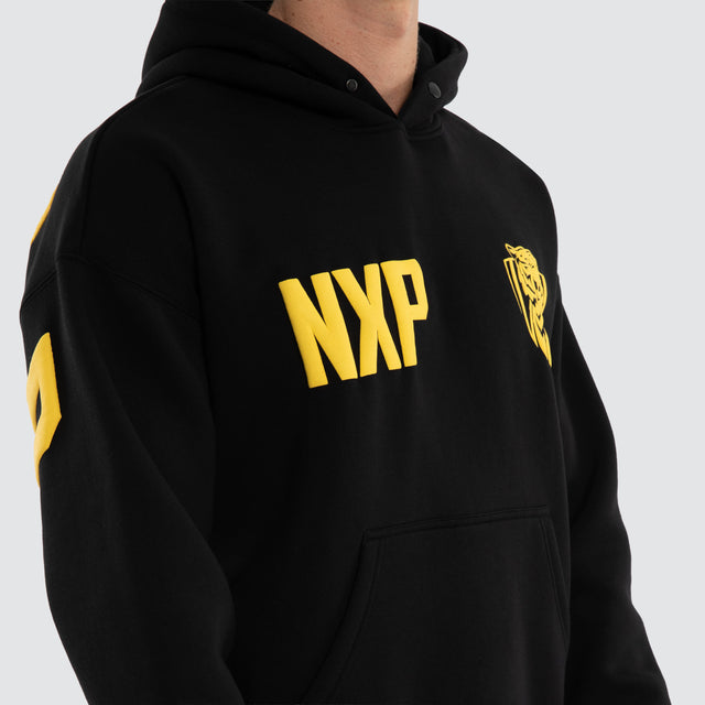 Model wears Richmond Tigers AFL Top Tier Hoodie Jet Black Hoodies in Black - Image 3