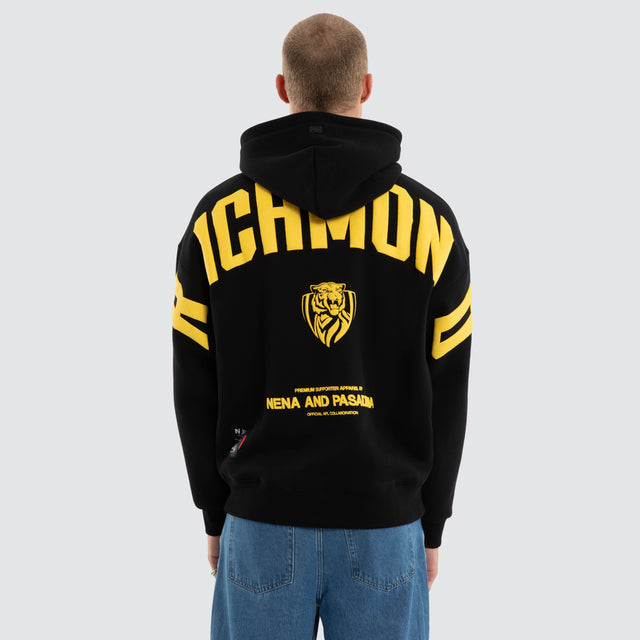 Model wears Richmond Tigers AFL Top Tier Hoodie Jet Black Hoodies in Black - Image 2