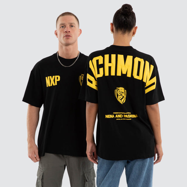 Model wears Richmond Tigers AFL Archive Raptor Tee Jet Black T-Shirts in Black - Image 1