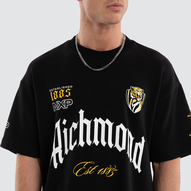 Model wears Richmond Tigers AFL Gold Raptor Tee Jet Black T-Shirts in Black - Image 2