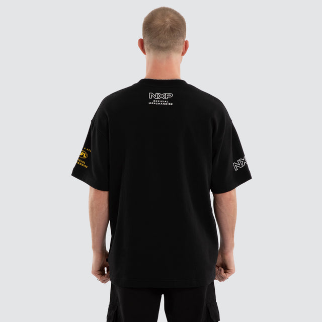 Model wears Richmond Tigers AFL Gold Raptor Tee Jet Black T-Shirts in Black - Image 5