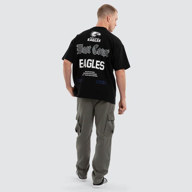 Model wears West Coast Eagles AFL Sticker Raptor Tee Jet Black T-Shirts in Black - Image 6