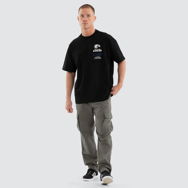 Model wears West Coast Eagles AFL Sticker Raptor Tee Jet Black T-Shirts in Black - Image 7