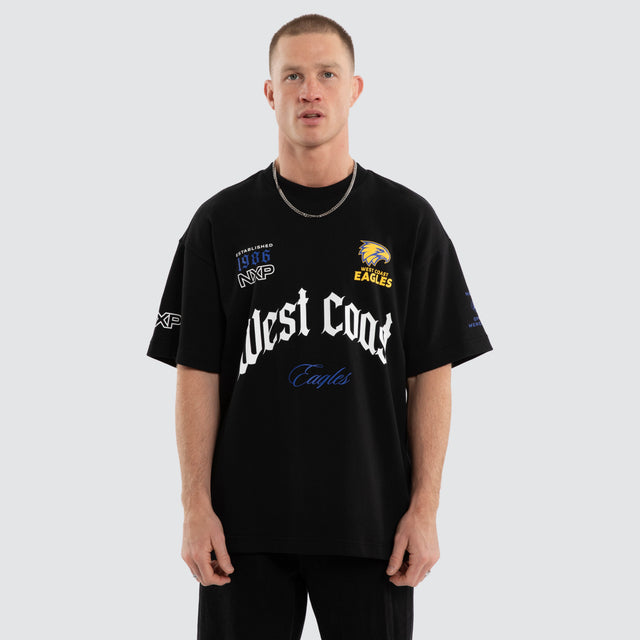 Model wears West Coast Eagles AFL Gold Raptor Tee Jet Black T-Shirts in Black - Image 1