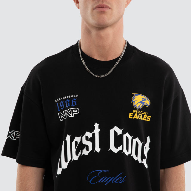 Model wears West Coast Eagles AFL Gold Raptor Tee Jet Black T-Shirts in Black - Image 2