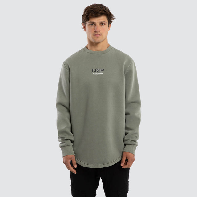 Model wears Overtake Curved Hem Sweater Green  Jumpers in Green - Image 1