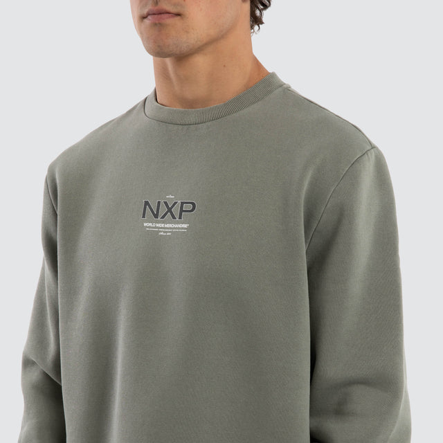 Model wears Overtake Curved Hem Sweater Green  Jumpers in Green - Image 3