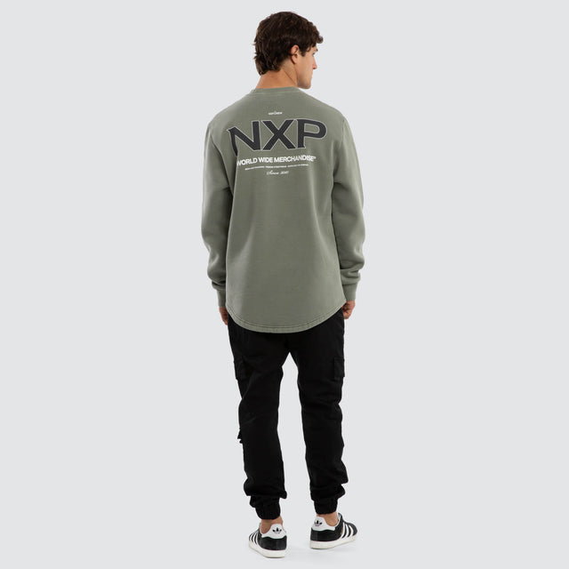 Model wears Overtake Curved Hem Sweater Green  Jumpers in Green - Image 4