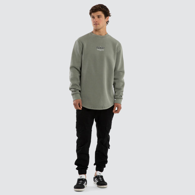 Model wears Overtake Curved Hem Sweater Green  Jumpers in Green - Image 5