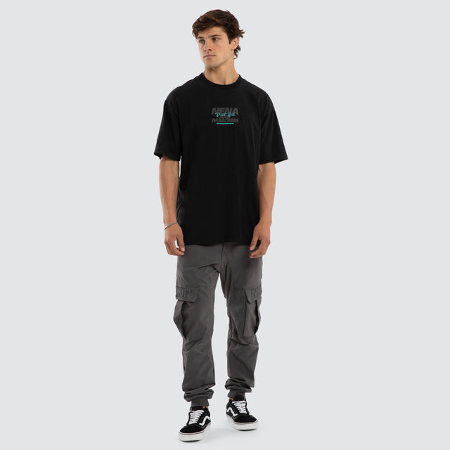 Model wears Hybrid Box Fit Tee Black  T-Shirts in Black - Image 5