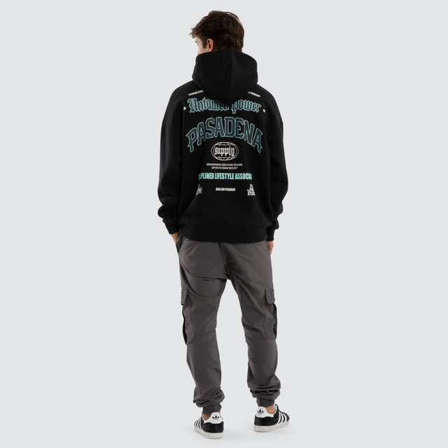 Model wears Mercy Box Fit Hoodie Black  Hoodies in Black - Image 4