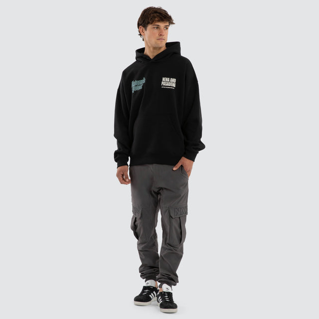 Model wears Mercy Box Fit Hoodie Black  Hoodies in Black - Image 5