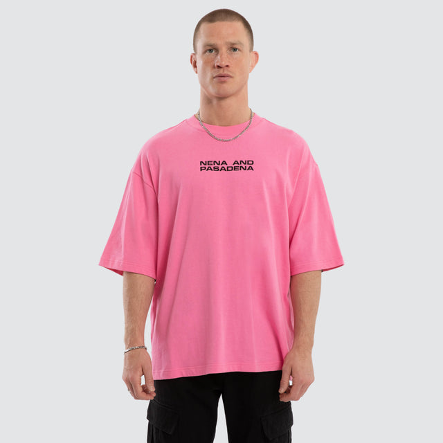 Model wears Grand Box Fit T-Shirt Pink and Black  T-Shirts in Pink - Image 1
