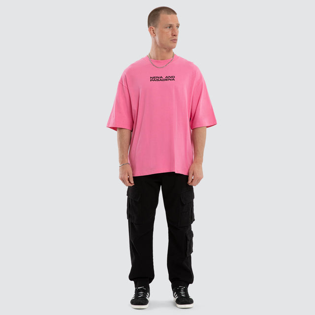Model wears Grand Box Fit T-Shirt Pink and Black  T-Shirts in Pink - Image 5