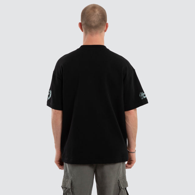 Model wears Drive Loopback Raptor Tee Jet Black T-Shirts in Black - Image 3
