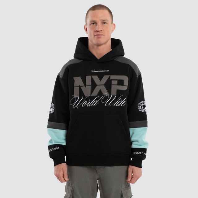 Model wears Wordly Relaxed Hoodie Jet Black Hoodies  – image 1