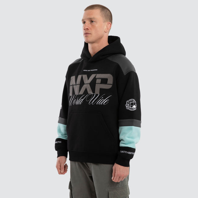Model wears Wordly Relaxed Hoodie Jet Black Hoodies  – image 3