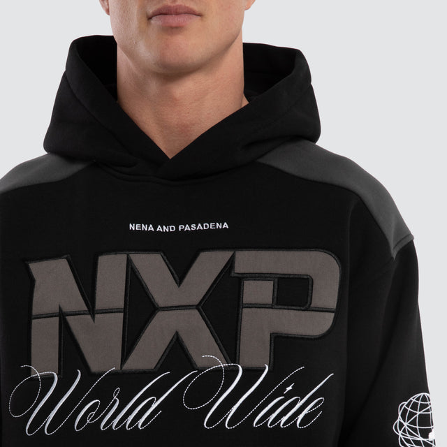 Model wears Wordly Relaxed Hoodie Jet Black Hoodies  – image 4