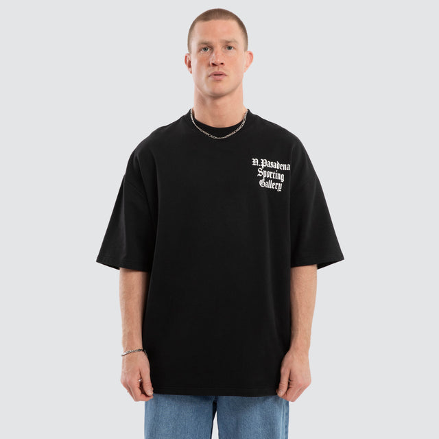 Model wears Outlap Gallery Tee Black  T-Shirts in Black - Image 1