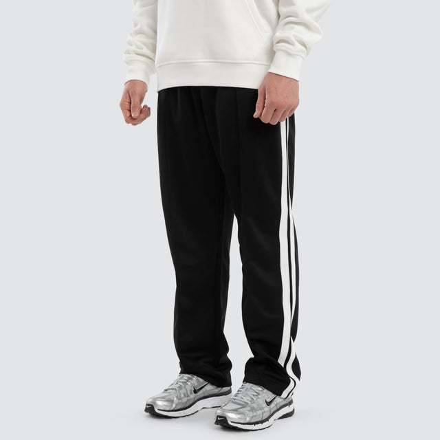 Model wears Turbo Sport Pant Jet Black  Pants in Black - Image 1