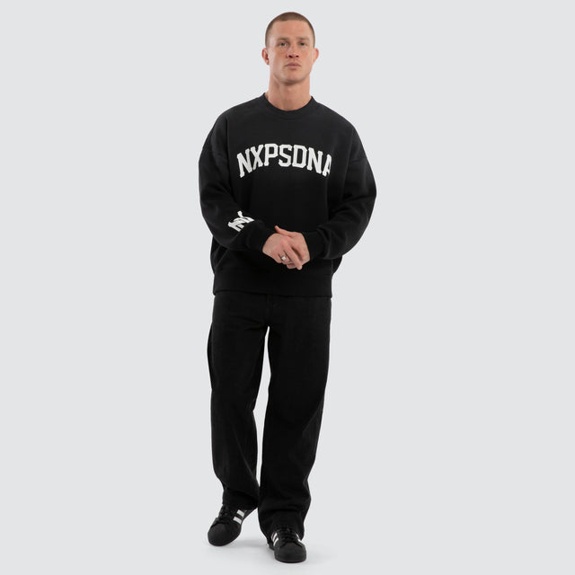 Model wears Halo Box Fit Hoodie Sunbleached Black  Jumpers in Black - Image 5
