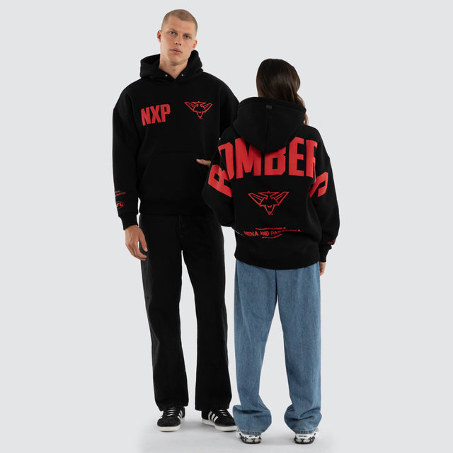 Model wears Essendon Bombers AFL Top Tier Hoodie Jet Black Hoodies in Black - Image 5