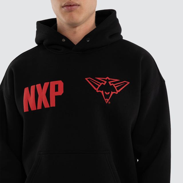 Model wears Essendon Bombers AFL Top Tier Hoodie Jet Black Hoodies in Black - Image 2