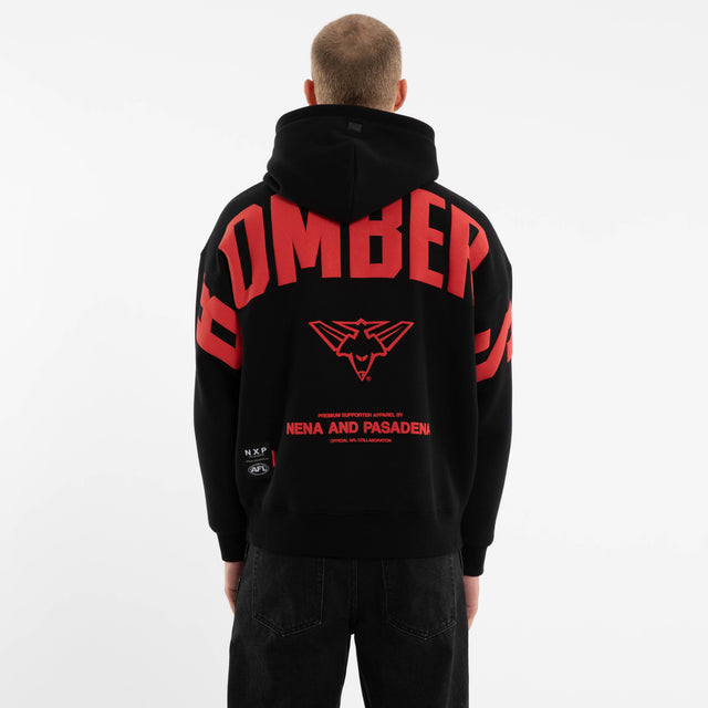 Model wears Essendon Bombers AFL Top Tier Hoodie Jet Black Hoodies in Black - Image 3