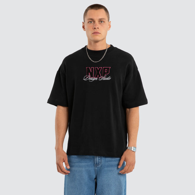 Model wears Dwell Loopback Raptor Tee Jet Black T-Shirts Black – image 2