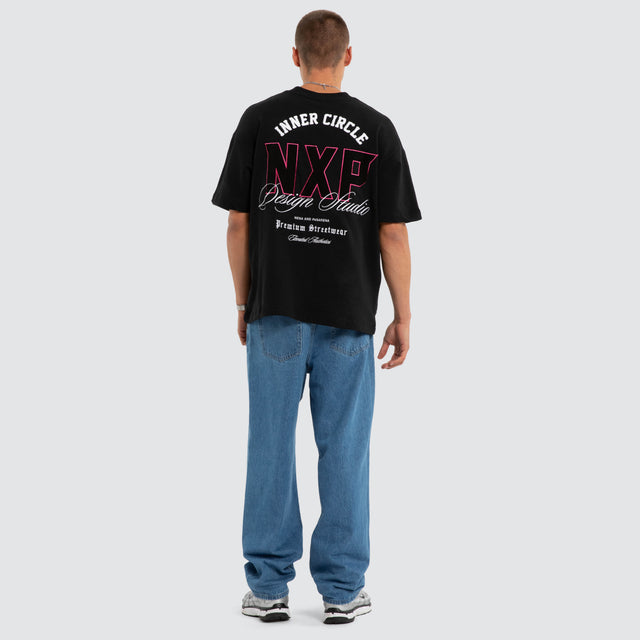Model wears Dwell Loopback Raptor Tee Jet Black T-Shirts Black – image 4