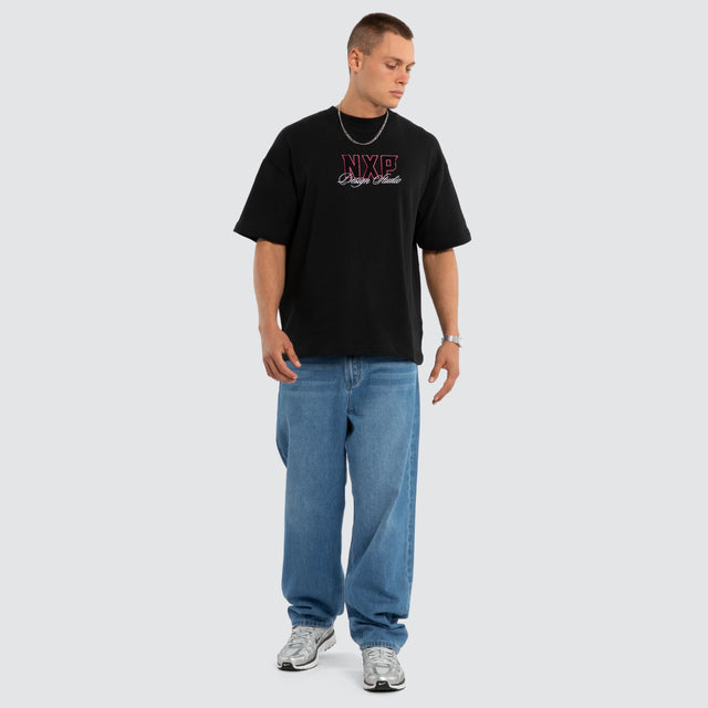 Model wears Dwell Loopback Raptor Tee Jet Black T-Shirts Black – image 5