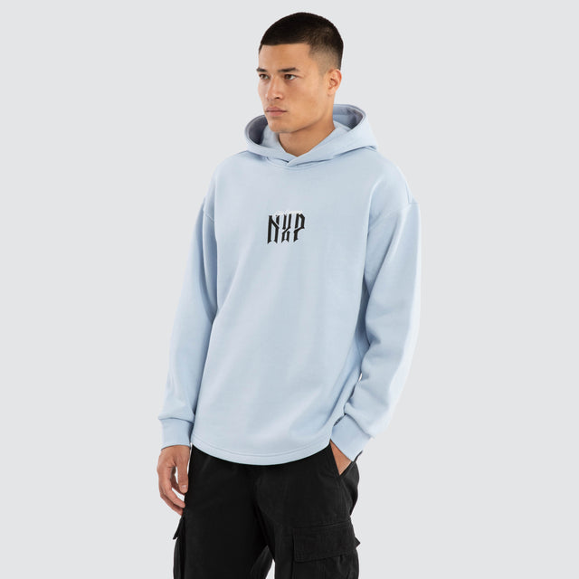 Model wears Dominate Relaxed Curved Hoodie Skyway Hoodies in Blue - Image 7