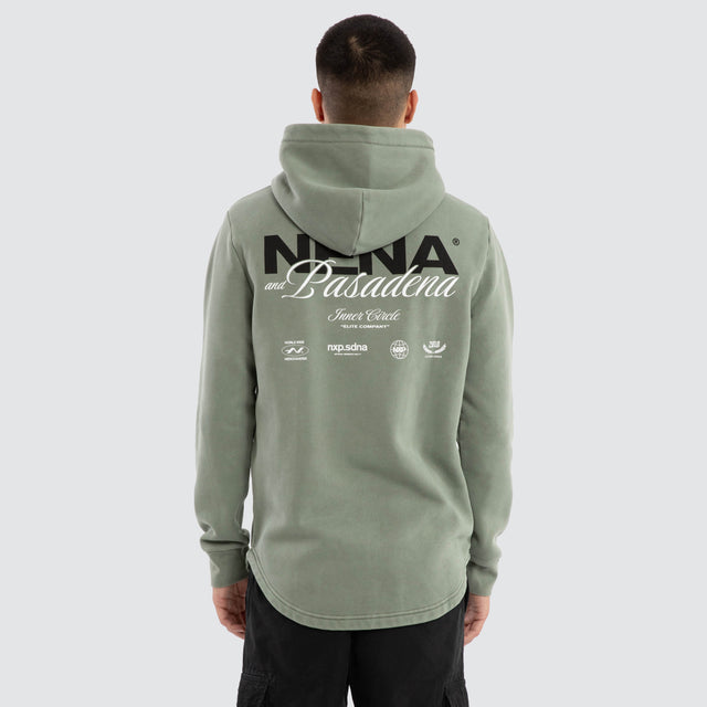 Model wears Neutral Curved Hem Hoodie Pigment Green Hoodies in Green - Image 4