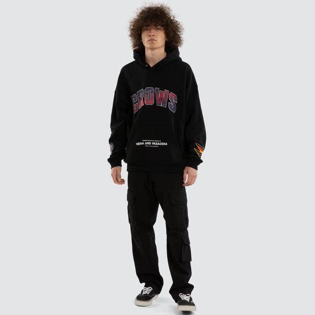 Model wears Ben Davis Adelaide Crows AFL Box Fit Hoodie Jet Black Hoodies in Black - Image 7