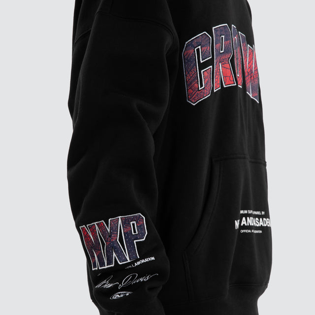 Model wears Ben Davis Adelaide Crows AFL Box Fit Hoodie Jet Black Hoodies in Black - Image 4