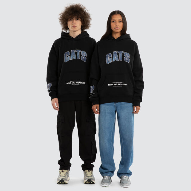 Model wears Ben Davis Geelong Cats AFL Box Fit Hoodie Jet Black Hoodies in Black - Image 4