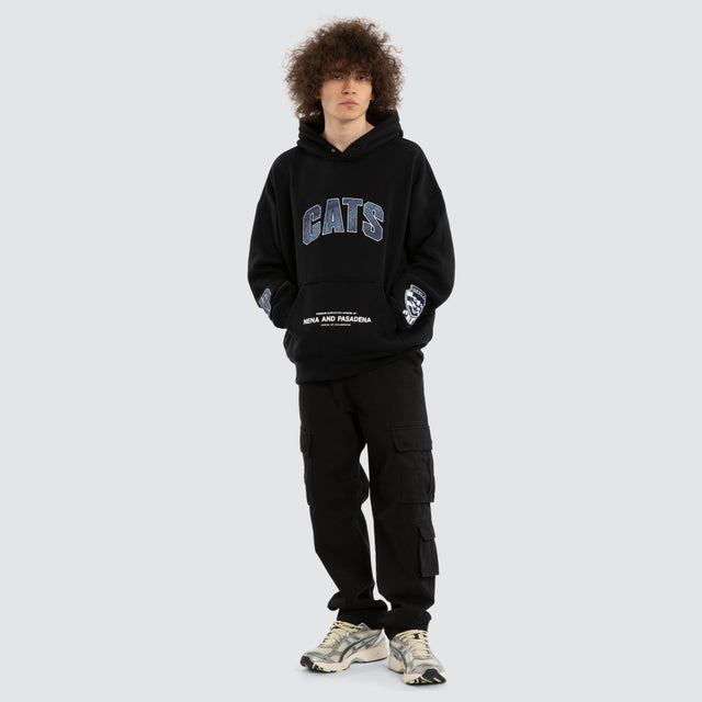 Model wears Ben Davis Geelong Cats AFL Box Fit Hoodie Jet Black Hoodies in Black - Image 6