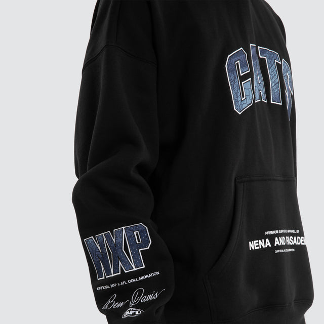 Model wears Ben Davis Geelong Cats AFL Box Fit Hoodie Jet Black Hoodies in Black - Image 3