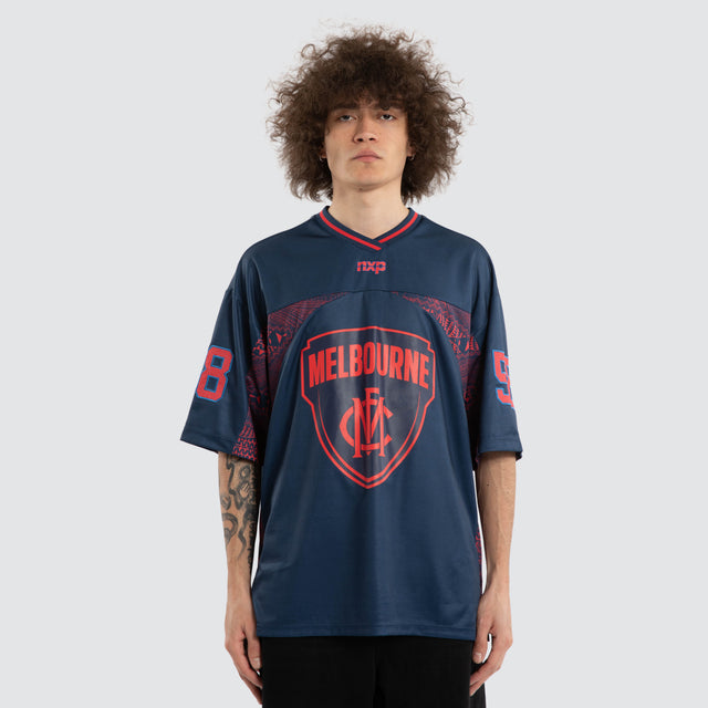 Model wears Ben Davis Melbourne Demons AFL Mesh Jersey Dees Navy Jerseys in Blue - Image 5