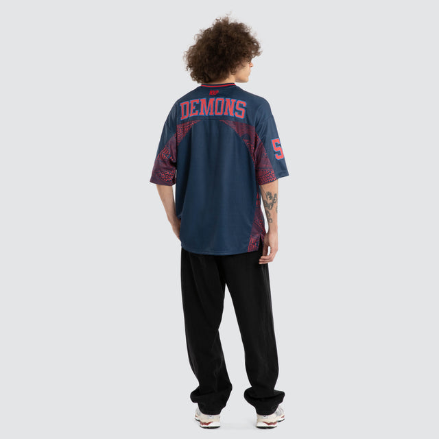 Model wears Ben Davis Melbourne Demons AFL Mesh Jersey Dees Navy Jerseys in Blue - Image 7