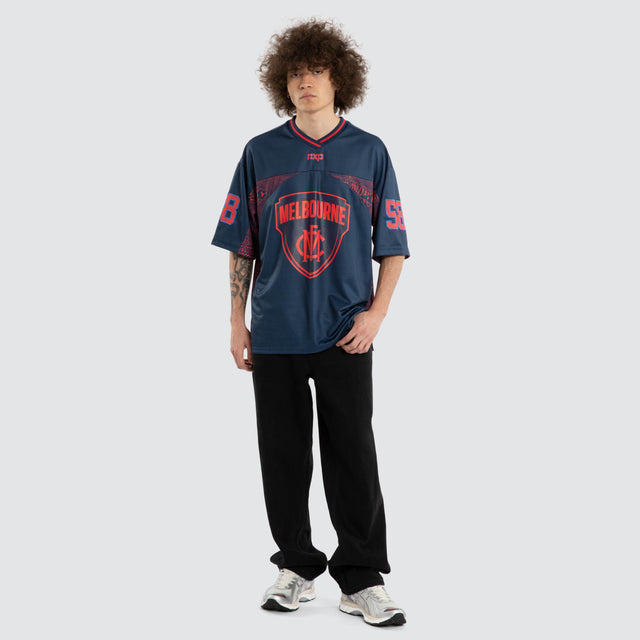 Model wears Ben Davis Melbourne Demons AFL Mesh Jersey Dees Navy Jerseys in Blue - Image 6