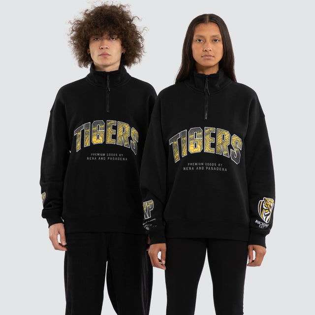 Model wears Ben Davis Richmond Tigers AFL 1/4 Zip Thru Jet Black Pullover in Black - Image 1