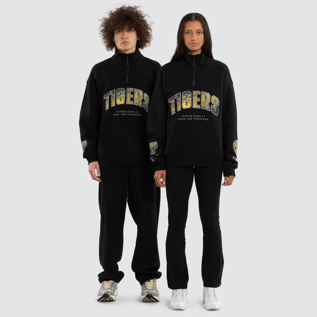 Model wears Ben Davis Richmond Tigers AFL 1/4 Zip Thru Jet Black Pullover in Black - Image 4